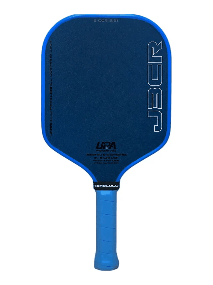 A blue and black pickleball paddle with a blue grip handle, featuring the J3CR logo and UPA certification on a white background.